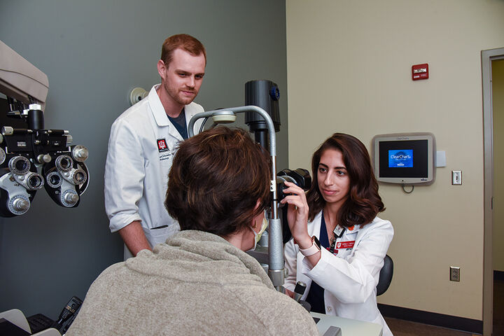 Ophthalmology students with a patient.